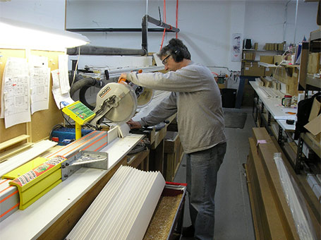 Custom window blinds and shades being crafted to order in a professional facility